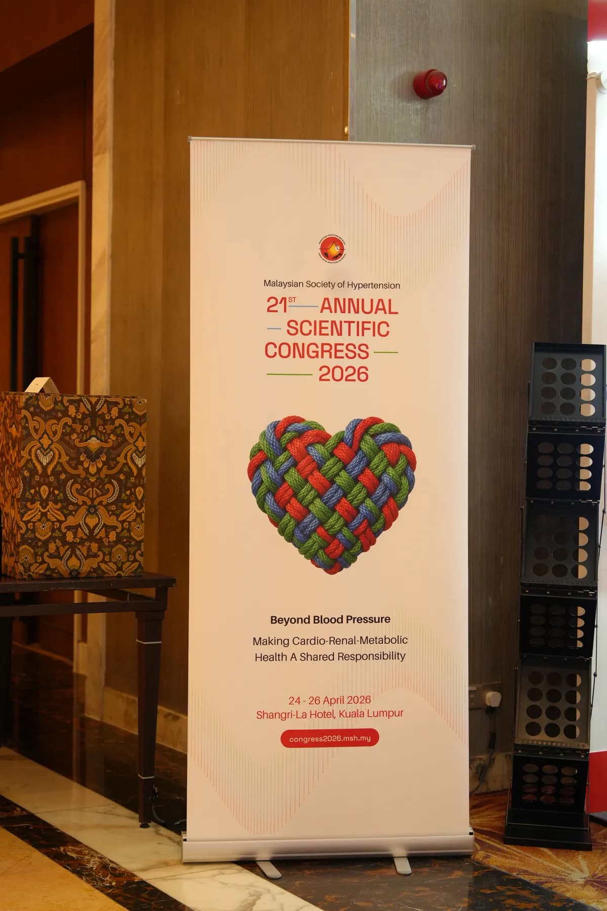 Large printed poster on a stand