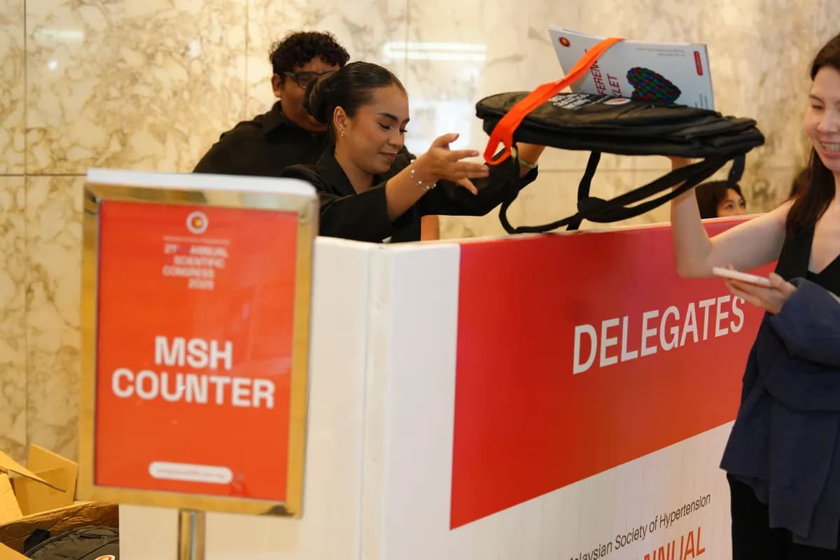 Printed counter panels and name tags at a conference check-in desk